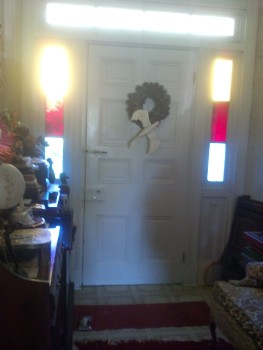 Original color-glass sidelights in Capt Henry's front door.